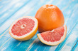 Photo: Fruits: fresh ripe grapefruits on wooden boards, studio shot Fruits: fresh ripe grapefruits on wooden boards, studio shot