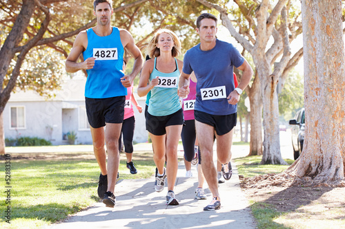 Photo: Group Of Runners On Suburban Street Group Of Runners On Suburban Street