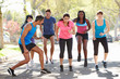 Photo: Group Of People Exercising Street With Personal Trainer Group Of People Exercising Street With Personal Trainer
