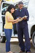 Photo: Customer Signing For Delivery From Courier Customer Signing For Delivery From Courier