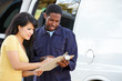 Photo: Customer Signing For Delivery From Courier Customer Signing For Delivery From Courier