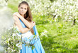 beautiful brunette woman in the park on a warm spring day