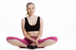Young woman sitting with legs crossed