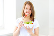 Teenager girl eating salad