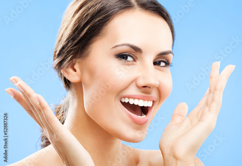 Photo: Portrait of beautiful woman, on blue Portrait of beautiful woman, on blue