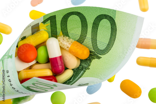 Photo: Tabletten und Einhundert Euroschein Tabletten und Einhundert Euroschein