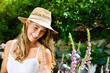 Photo: Woman gardener standing in the garden Woman gardener standing in the garden