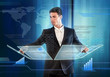 Businessman pressing items on a touch screen panel