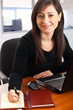 Young businesswoman at her desk