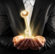 Male hands holding a golden key