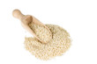 Sesame seeds in a spoon for spices isolated on a white backgroun