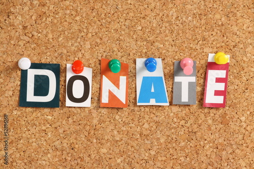 Photo: The word Donate on a Cork Notice Board The word Donate on a Cork Notice Board