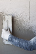 Construction site - Worker performs internal plaster