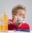 Man with shaving cream to his face