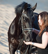 women with black horse.