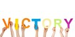 Foto: hands holding victory hands holding victory