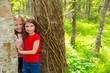Photo: children friends playing in tree trunks at the jungle park children friends playing in tree trunks at the jungle park