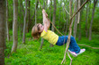 Photo: girls playing hanging in lianas at the jungle park girls playing hanging in lianas at the jungle park