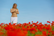 Nude girl in a poppy field