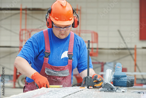 Photo: Builder worker at construction site Builder worker at construction site