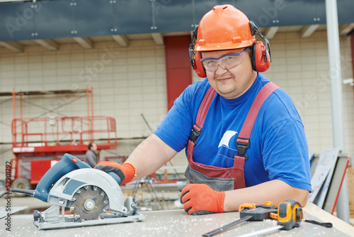 Photo: Portrait of builder worker at construction site Portrait of builder worker at construction site