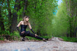 Beautiful elegant woman walking on a country road