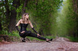 Beautiful elegant woman walking on a country road
