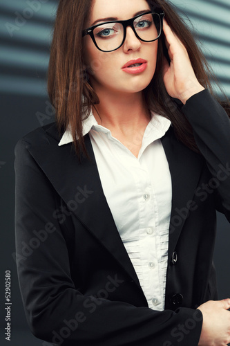Photo: businesswoman looking at camera businesswoman looking at camera