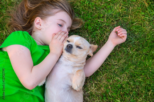 Photo: Blond happy girl with her chihuahua doggy portrait Blond happy girl with her chihuahua doggy portrait