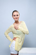 Photo: Smiling cute girl posing in yellow blouse Smiling cute girl posing in yellow blouse