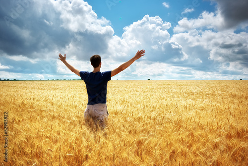 Photo: Man in meadow of wheat Man in meadow of wheat
