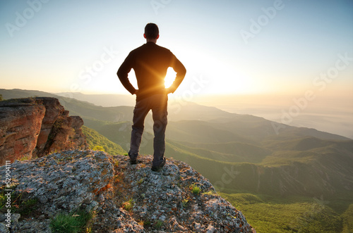 Photo: Man on top of mountain Man on top of mountain