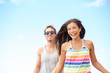 Young couple enjoying beach fun laughing running