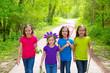 Photo: Friends and sister girls walking outdoor in forest track Friends and sister girls walking outdoor in forest track