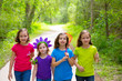 Photo: Friends and sister girls walking outdoor in forest track Friends and sister girls walking outdoor in forest track
