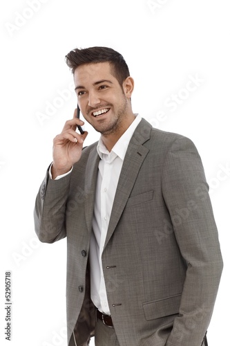Photo: Happy businessman talking on mobile Happy businessman talking on mobile