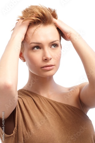 Photo: Portrait of pretty woman with hand in hair Portrait of pretty woman with hand in hair