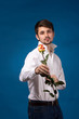 Man giving the red roses