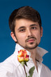 Man giving the red roses. Close up portrait.