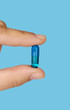 Hand holding a pill medication