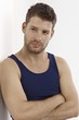 Photo: Young man in vest standing arms crossed Young man in vest standing arms crossed