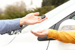 Woman and man hands with car key, close up