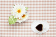 coffee and white artificial flowers