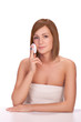Young girl with natural skin cleaning face