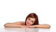 Portrait of a smiling young female lying down