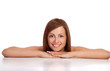 Portrait of a smiling young female lying down