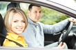Photo: Portrait of young beautiful couple sitting in the car Portrait of young beautiful couple sitting in the car
