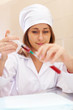 Young nurse with test tube