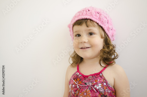 Photo: portrait of little girl with pink handmade cap portrait of little girl with pink handmade cap