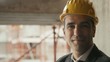 Engineer with helmet smiling in construction site, portrait